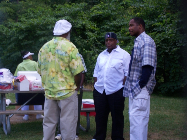 Stanley Weaver, Nathaniel Grier and William Streety enjoy themselves at the picnic.