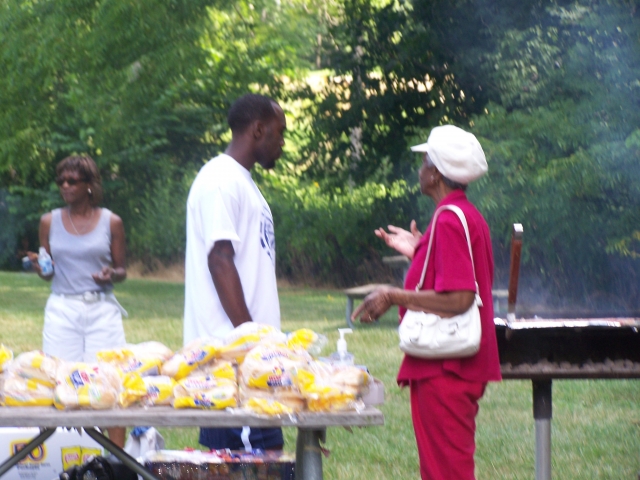 Members of the Detroit Committee prepare food for the picnic in the park.