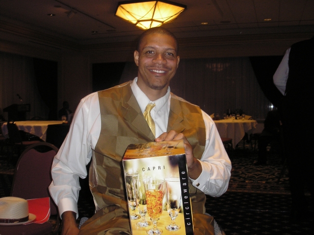 Albert Carr shows off his prize that he won during the banquet.