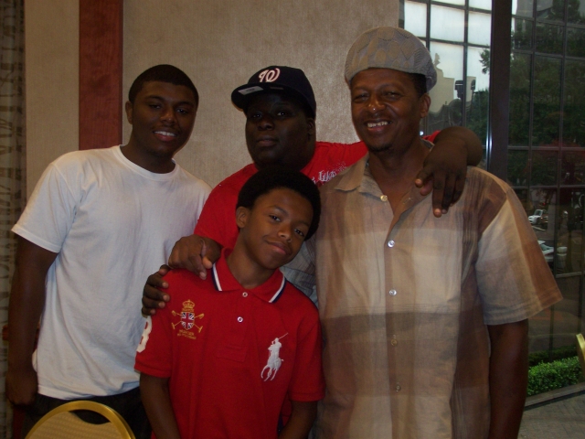 Joe Grier, with sons Joshua and Jeremiah, along with great-nephew, Caderis